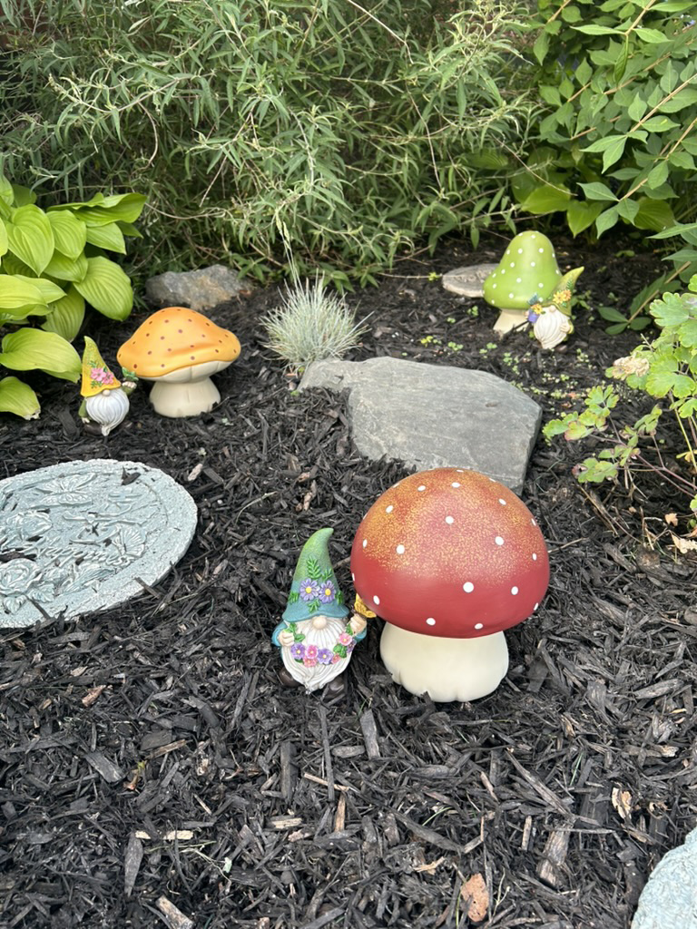 Garden gnomes and mushrooms representing earth medicine